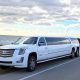 White Cadillac Escalade limousine parked by the ocean