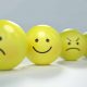 Four emojis showing different emotions: sad, happy, angry, and annoyed.
