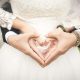 Couple's hands forming a heart shape