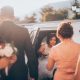 a bride getting out of a limousine