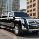 Black Cadillac Escalade limousine on city street. Luxury car service.