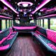 Luxury party bus interior with pink and black leather seating, perfect for a sweet sixteen celebration from BergenLimo.com.