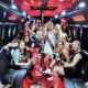 Bride-to-be and friends celebrating on a party bus during a bachelorette party.