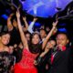Excited teens celebrate in a Bergen Limo party bus, perfect for a Quinceañera.