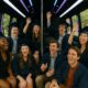 Excited graduating celebrating in a party bus, perfect for graduation 2025.