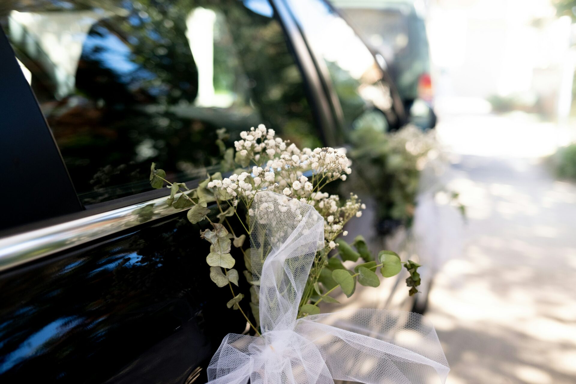 A close up photo of a black limo at a wedding in New Jersey
